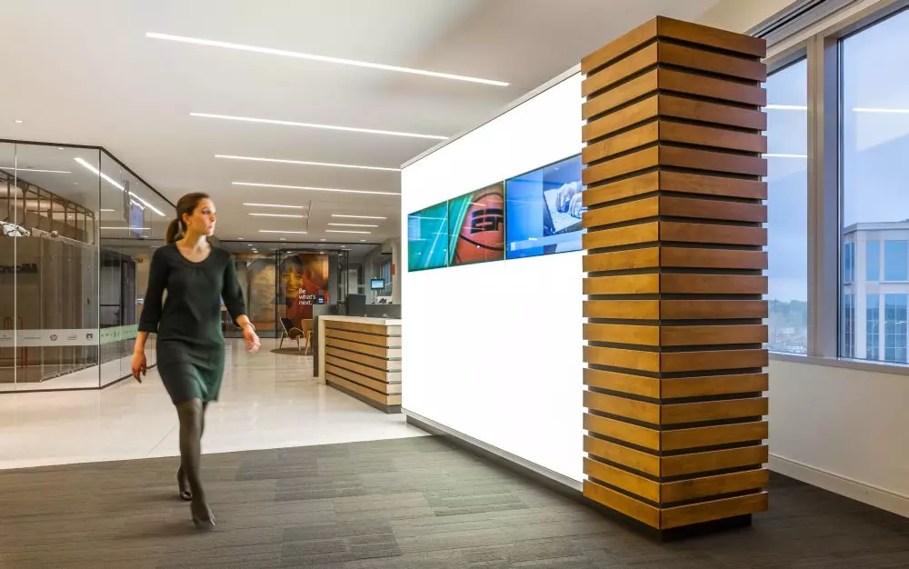 Woman walking down the corridor in the office