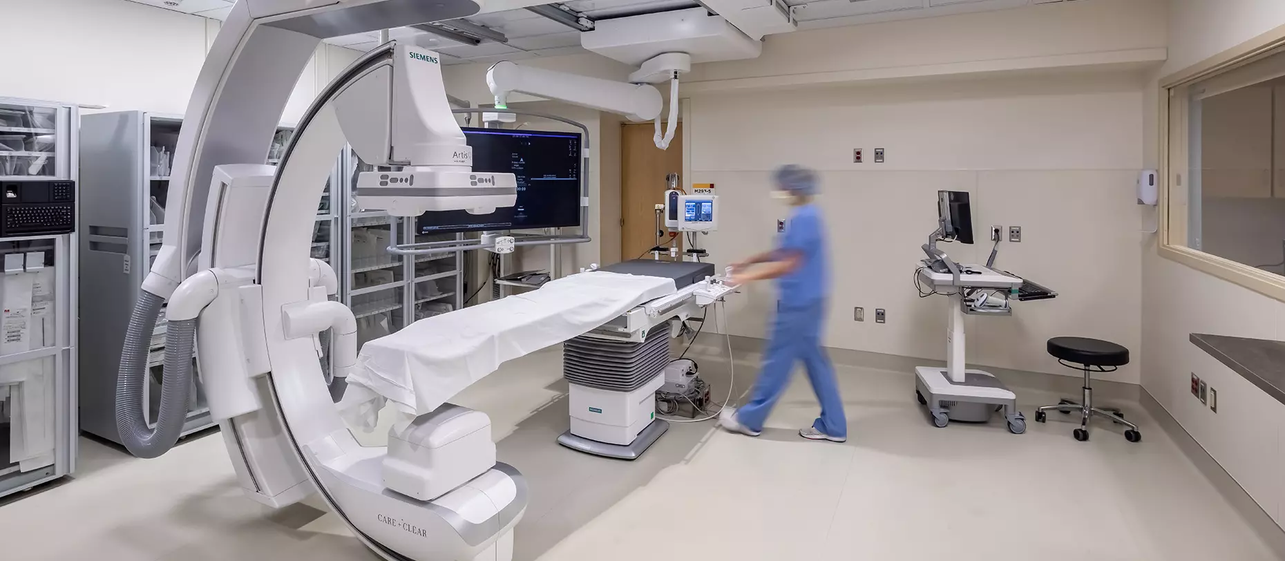 Hospital worker preparing rooms for medical examinations