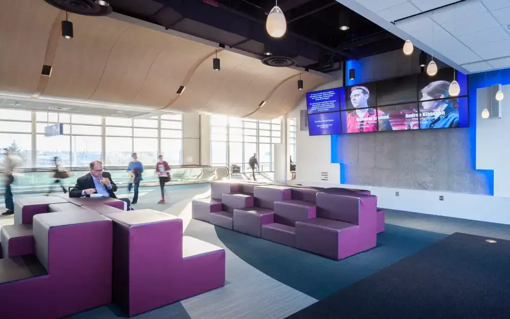 Terminal 1 waiting room with TVs