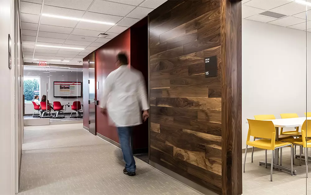 Man walking along the corridor in the building